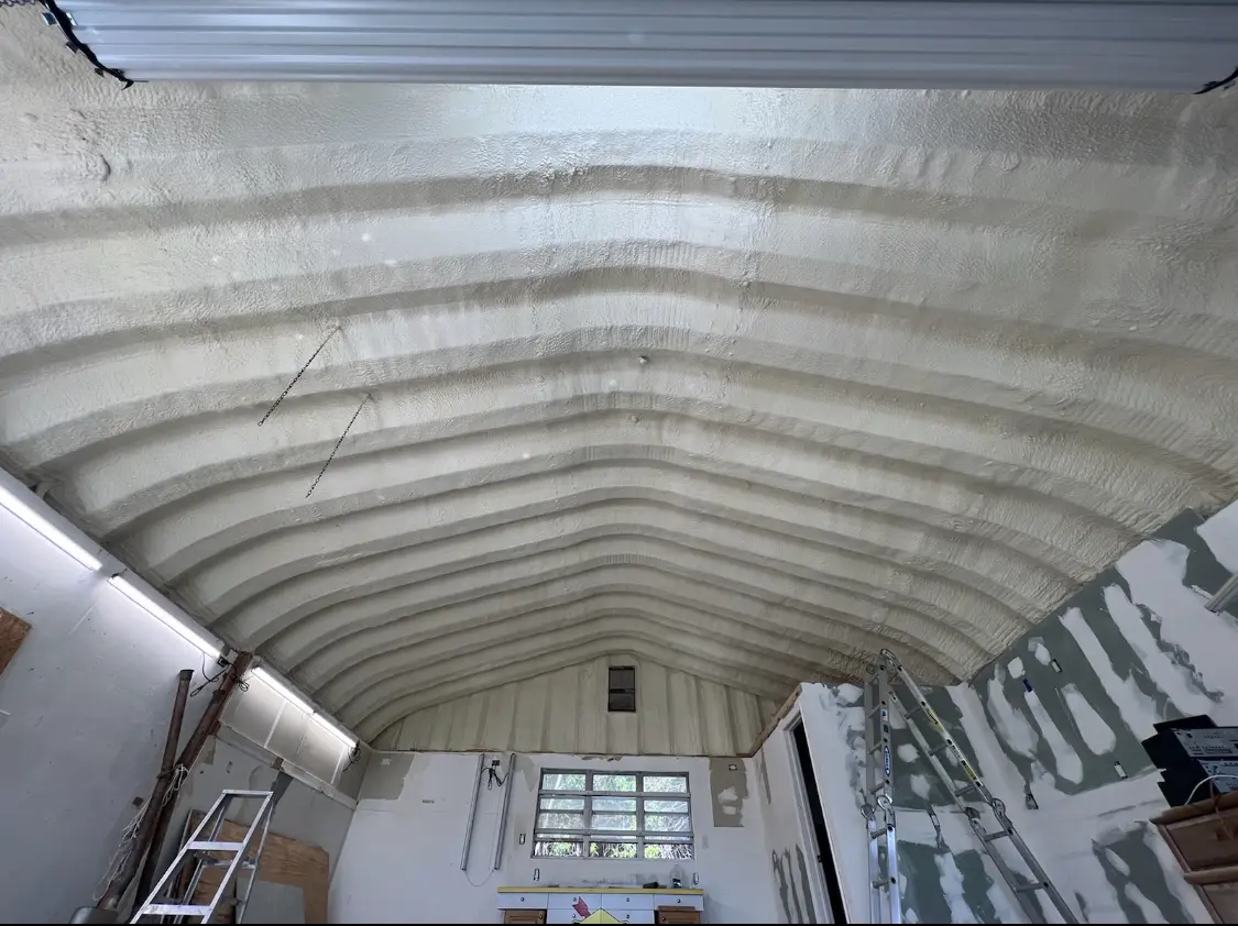 Spray polyurethane foam applied to the underside of a metal roof deck in Massapequa Park