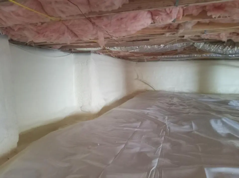 Crawl space encapsulation with closed-cell spray foam for Storm Damage Roof Repair in Massapequa Park